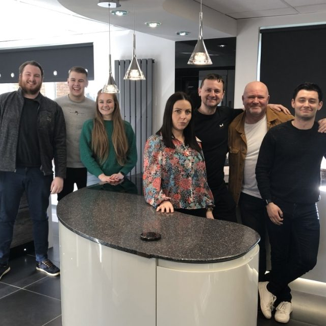 Tommy Welsh with part of his kitchen and bathroom showroom team